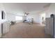 A spacious main bedroom featuring a ceiling fan, carpeted floors and a nook for an office at 25051 N 140Th Dr, Surprise, AZ 85387