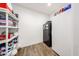 Organized pantry with wood look floors, shelving, and plenty of storage space at 25051 N 140Th Dr, Surprise, AZ 85387