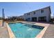 Inviting backyard with a sparkling pool and a well-maintained lawn, perfect for outdoor gatherings and enjoyment at 25051 N 140Th Dr, Surprise, AZ 85387