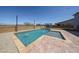 Enjoy a refreshing pool with stone trim and water features creating a luxurious and inviting backyard oasis at 25051 N 140Th Dr, Surprise, AZ 85387