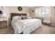 Serene bedroom featuring a plush bed with neutral bedding, plantation shutters, and calming decor at 25225 S Glenburn Dr, Sun Lakes, AZ 85248