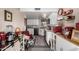 Charming kitchen featuring white cabinets, granite countertops, and a unique breakfast area with stylish seating at 25225 S Glenburn Dr, Sun Lakes, AZ 85248