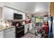 Well-lit kitchen with white cabinetry, granite countertops, and a cozy breakfast nook overlooking the backyard at 25225 S Glenburn Dr, Sun Lakes, AZ 85248