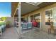 Covered patio with comfortable seating, brick flooring, a ceiling fan and views of the backyard at 25225 S Glenburn Dr, Sun Lakes, AZ 85248