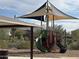 Community playground featuring a covered slide and sunshade at 26370 N 77Th Dr, Peoria, AZ 85383
