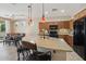 Open kitchen with modern appliances, ample counter space, and pendant lighting at 27023 N 130Th Gln, Peoria, AZ 85383
