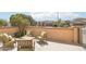 Cozy patio features desert landscaping and ample seating for enjoying the beautiful outdoors at 27023 N 130Th Gln, Peoria, AZ 85383