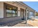 Inviting front entry featuring a stylish security door, covered porch, and a charming front porch swing at 2708 E Villa Theresa Dr, Phoenix, AZ 85032