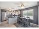Eat-in kitchen featuring stainless appliances, a breakfast bar, modern cabinetry, and lots of natural light at 2708 E Villa Theresa Dr, Phoenix, AZ 85032