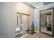 Mud room with storage racks, cleaning tools, and easy access to the garage at 2708 E Villa Theresa Dr, Phoenix, AZ 85032