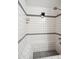 All-tile shower with built-in bench, providing comfort and luxury at 2708 E Villa Theresa Dr, Phoenix, AZ 85032