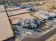 Aerial shot of luxury home, desert landscape, circular driveway and neighboring properties at 3518 N 201St Ln, Buckeye, AZ 85396