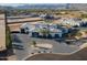 Aerial view showcasing the modern design of the luxury home and circular driveway at 3518 N 201St Ln, Buckeye, AZ 85396