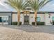 Elegant home entrance with dual palm trees and a beautifully designed walkway at 3518 N 201St Ln, Buckeye, AZ 85396