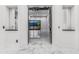 Bright foyer with marble floors, leading to an open living area with backyard view at 3518 N 201St Ln, Buckeye, AZ 85396