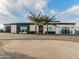 Stunning single-story home featuring desert landscaping and custom paved driveway at 3518 N 201St Ln, Buckeye, AZ 85396