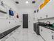 Large laundry room featuring sink, storage, modern appliances and plenty of space at 3518 N 201St Ln, Buckeye, AZ 85396