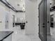 A spacious main bathroom with a sleek freestanding tub and elegant chandelier at 3518 N 201St Ln, Buckeye, AZ 85396