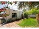 Charming backyard with lush plants, desert landscaping and a well-maintained exterior at 356 W Roma Ave, Phoenix, AZ 85013