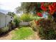 Private backyard showcasing vibrant flowers, mature trees, and a well-maintained lawn at 356 W Roma Ave, Phoenix, AZ 85013