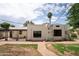 Spacious backyard featuring a brick pathway, desert landscaping, and an open-air pergola with outdoor seating at 356 W Roma Ave, Phoenix, AZ 85013