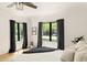 Bright bedroom with ample natural light, featuring a ceiling fan, wood floor and tranquil view at 356 W Roma Ave, Phoenix, AZ 85013