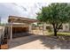 Carport and backyard featuring a concrete driveway, covered parking, and easy access to outdoor living spaces at 356 W Roma Ave, Phoenix, AZ 85013