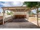Carport featuring covered parking, storage, and convenient access to outdoor areas, perfect for vehicle protection and storage at 356 W Roma Ave, Phoenix, AZ 85013