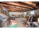 Carport featuring exposed wood beams, open ceiling and ample storage space at 356 W Roma Ave, Phoenix, AZ 85013