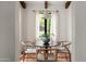 Cozy dining area with natural lighting and seating for four creates a comfortable and inviting atmosphere at 356 W Roma Ave, Phoenix, AZ 85013
