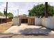 Long driveway to the covered carport in the backyard with wooden gate at 356 W Roma Ave, Phoenix, AZ 85013