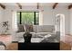 Bright living room with a large window, neutral tones, and a comfortable sofa creating a relaxing space at 356 W Roma Ave, Phoenix, AZ 85013