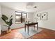 Bright home office with terra cotta tile, stylish décor, a cozy rug, and lots of natural light at 356 W Roma Ave, Phoenix, AZ 85013