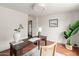 Bright home office with natural light, stylish decor, a cozy rug, and views of the outdoors at 356 W Roma Ave, Phoenix, AZ 85013