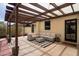 Relaxing pergola with a comfortable sectional sofa, ideal for enjoying the outdoors in style and comfort at 356 W Roma Ave, Phoenix, AZ 85013