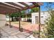 Pergola and garden featuring a seating area and vibrant plants, perfect for enjoying the outdoors and relaxing in style at 356 W Roma Ave, Phoenix, AZ 85013