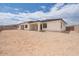Expansive backyard featuring desert landscaping and a modern home exterior at 3824 W Lodge Dr, Laveen, AZ 85339