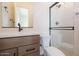 Bathroom featuring a modern vanity with a vessel sink and a tiled shower with glass doors at 3824 W Lodge Dr, Laveen, AZ 85339