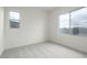 Bedroom featuring neutral carpet, white walls, and a window with natural light at 3824 W Lodge Dr, Laveen, AZ 85339