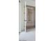Entryway featuring neutral carpet, wood-look floors, and a view through open white doors to other rooms at 3824 W Lodge Dr, Laveen, AZ 85339
