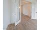 Bright entryway with wood-look tile flooring and a view into the next room through glass paneled doors at 3824 W Lodge Dr, Laveen, AZ 85339