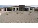 Single story home featuring a low maintenance front yard, attached garage, and neutral color palette at 3824 W Lodge Dr, Laveen, AZ 85339