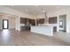 Spacious kitchen with stainless steel appliances, gray cabinets, a white island, and tiled floors at 3824 W Lodge Dr, Laveen, AZ 85339