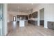 Open concept kitchen with island, stainless appliances, and tile floors in an expansive living space at 3824 W Lodge Dr, Laveen, AZ 85339