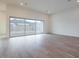 Bright living room with tile floors, recessed lights, sliding glass doors leading to an outdoor view at 3824 W Lodge Dr, Laveen, AZ 85339