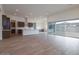 Open-concept living room featuring tile floors, recessed lighting, and a modern kitchen with stainless steel appliances at 3824 W Lodge Dr, Laveen, AZ 85339
