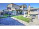 Beautiful backyard featuring a basketball hoop, gazebo, artificial grass, and brick patio at 4507 S 119Th Dr, Avondale, AZ 85323