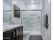 Clean bathroom showcasing glass-enclosed shower, dark vanity, and modern fixtures at 4507 S 119Th Dr, Avondale, AZ 85323