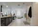 Bright bathroom features a long vanity, soaking tub, glass enclosed shower, and modern fixtures at 4507 S 119Th Dr, Avondale, AZ 85323
