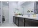 Bright bathroom with a double sink vanity, decorative accents, and a shower-tub combination at 4507 S 119Th Dr, Avondale, AZ 85323